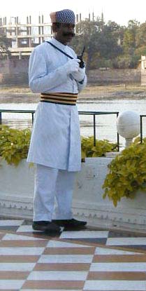 This elaborately dressed gentleman is the "boatman" at the Lake Palace Hotel. His position is similar to "doorman", but his main duty is controlling the flow of boats that carry the guests from the hotel to the shore.